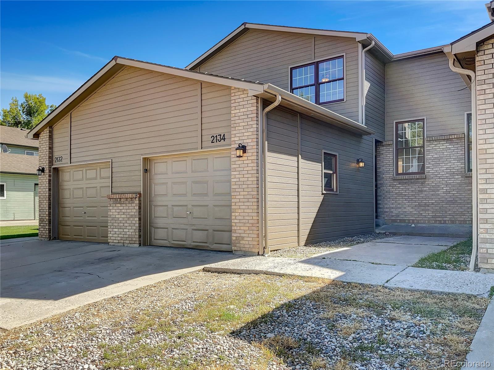2134 3rd Street Southwest, Unit 2 Loveland, CO 80537 - Photo 1 of 31 a view of backyard of house