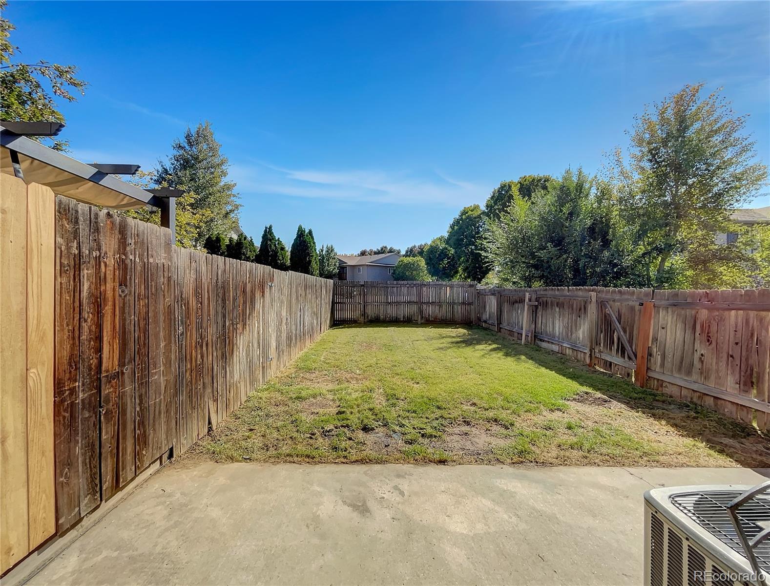 2134 3rd Street Southwest, Unit 2 Loveland, CO 80537 - Photo 26 of 31 a view of back yard with wooden fence