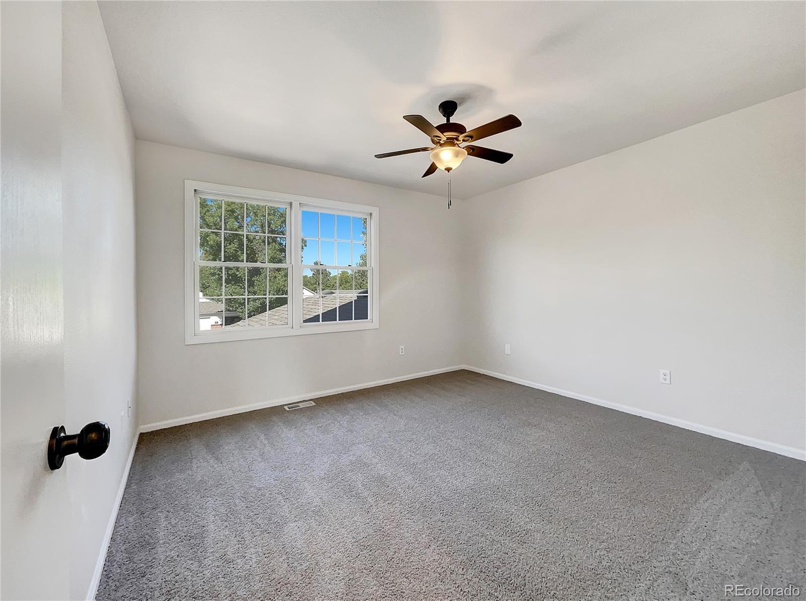 2134 3rd Street Southwest, Unit 2 Loveland, CO 80537 - Photo 3 of 31 a view of an empty room with a window