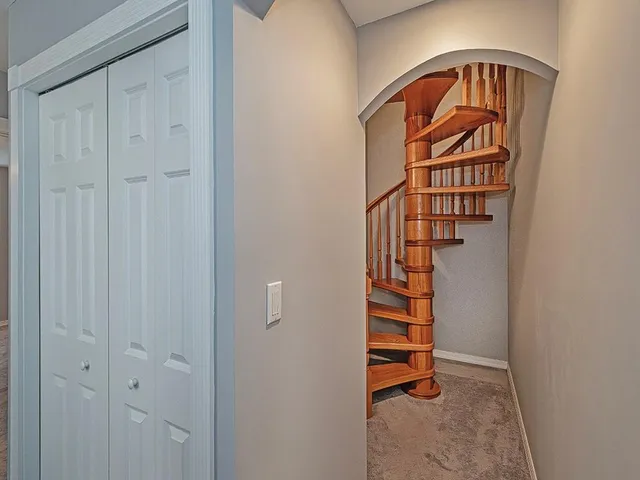 a bedroom with a bed and a desk