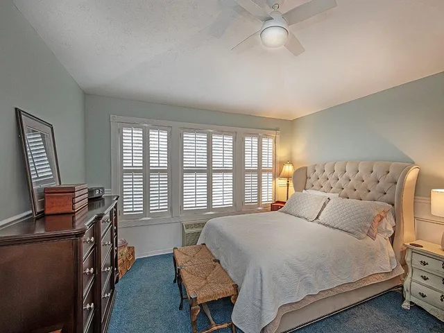 a bedroom with furniture and a window