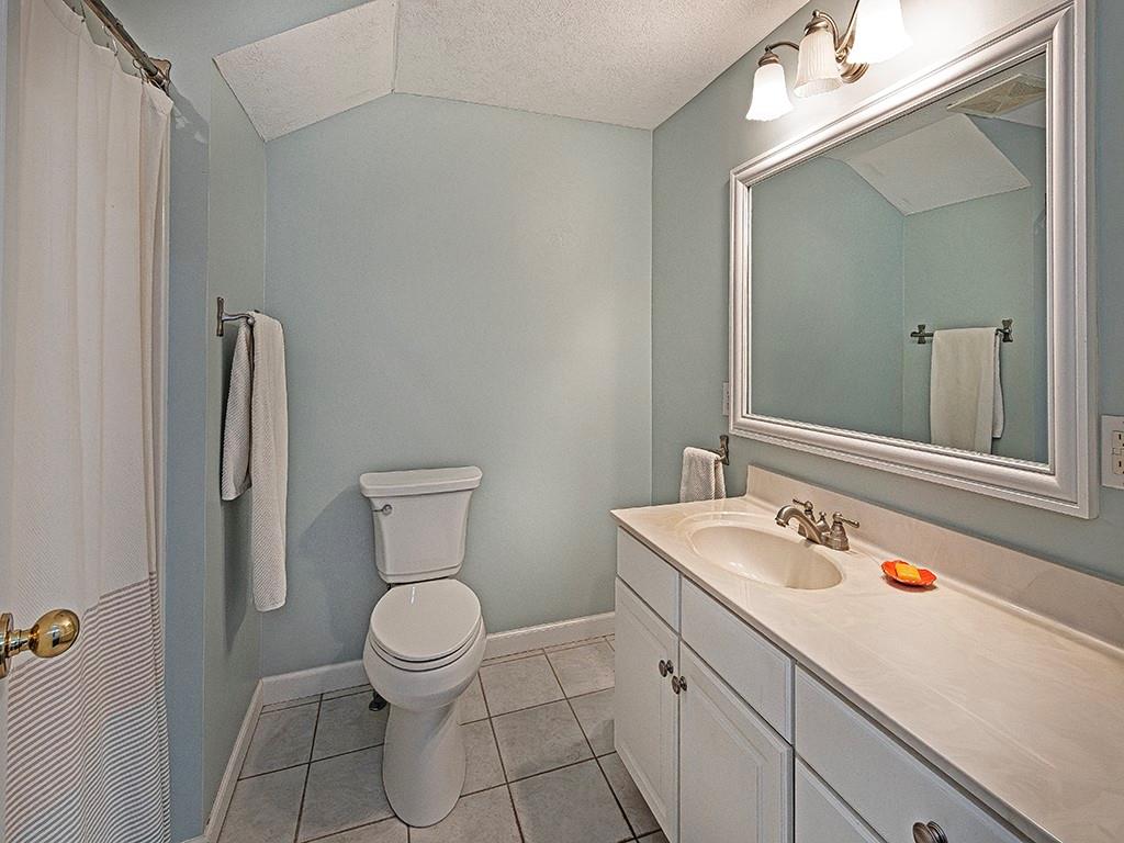 1001 Eddy Court Gibsonia, PA 15044 - Photo 18 of 29 a bathroom with a toilet a sink and mirror