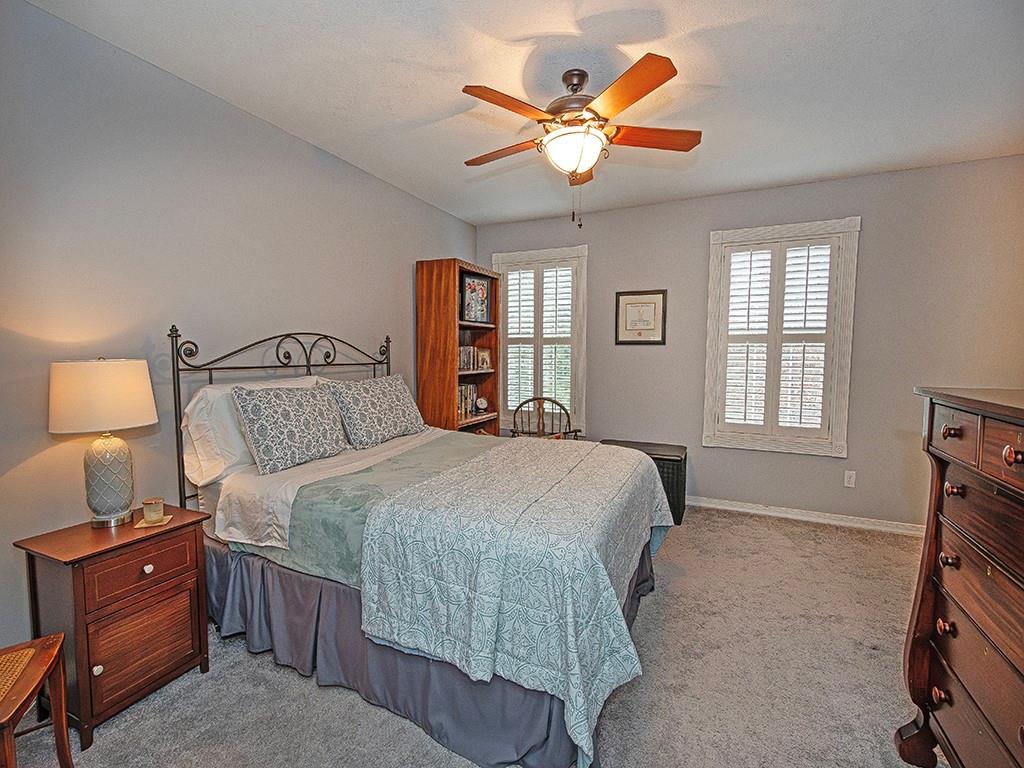 1001 Eddy Court Gibsonia, PA 15044 - Photo 20 of 29 a bedroom with a bed and a chandelier