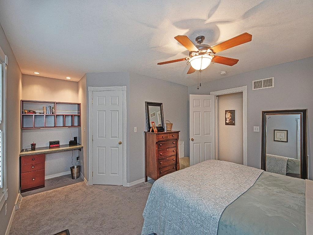 1001 Eddy Court Gibsonia, PA 15044 - Photo 21 of 29 a bedroom with a bed and dresser with wooden floor