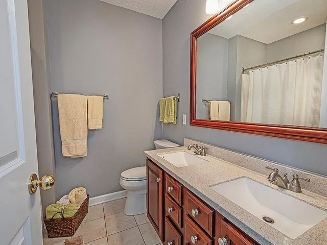 a living room with furniture and a chair