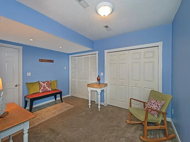 a room with furniture and stairs