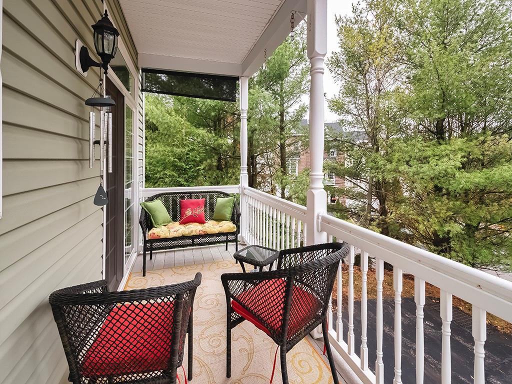 1001 Eddy Court Gibsonia, PA 15044 - Photo 28 of 29 a balcony with wooden floor and outdoor seating