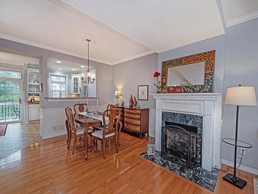1001 Eddy Court Gibsonia, PA 15044 - Photo 6 of 29 a living room with furniture a fireplace and kitchen view