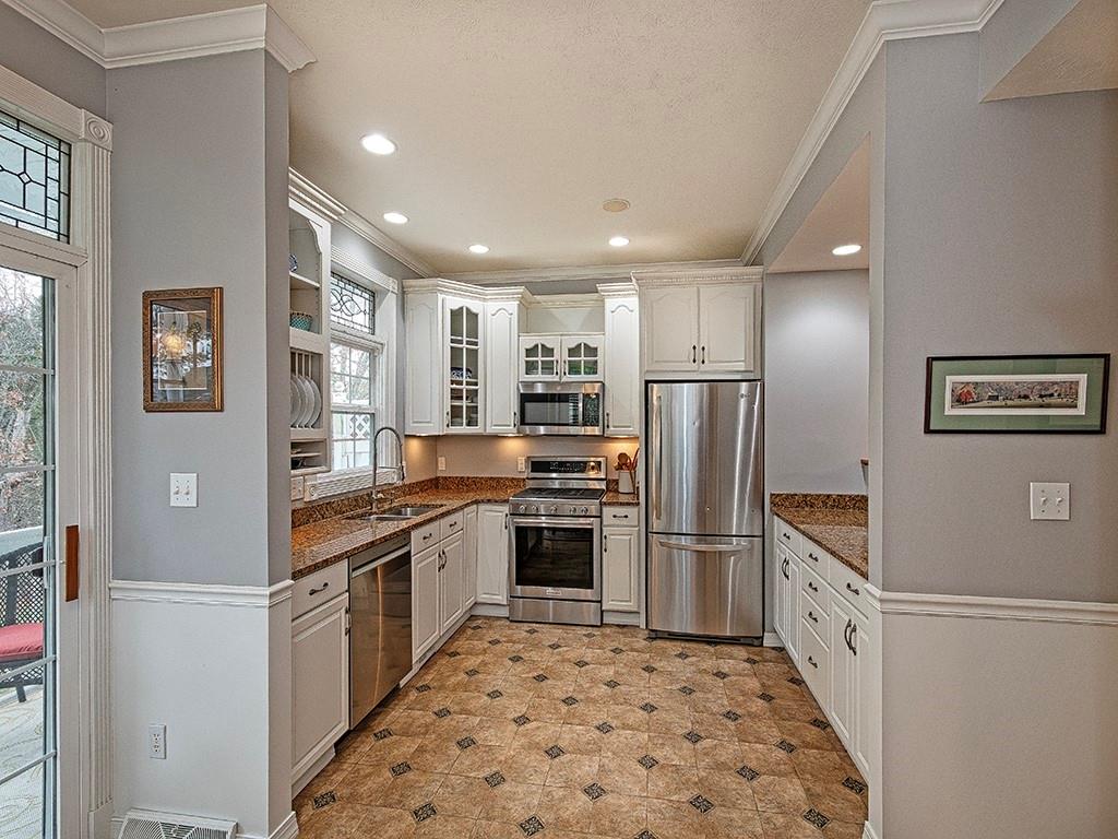 1001 Eddy Court Gibsonia, PA 15044 - Photo 10 of 29 a kitchen with stainless steel appliances granite countertop a refrigerator and a stove top oven