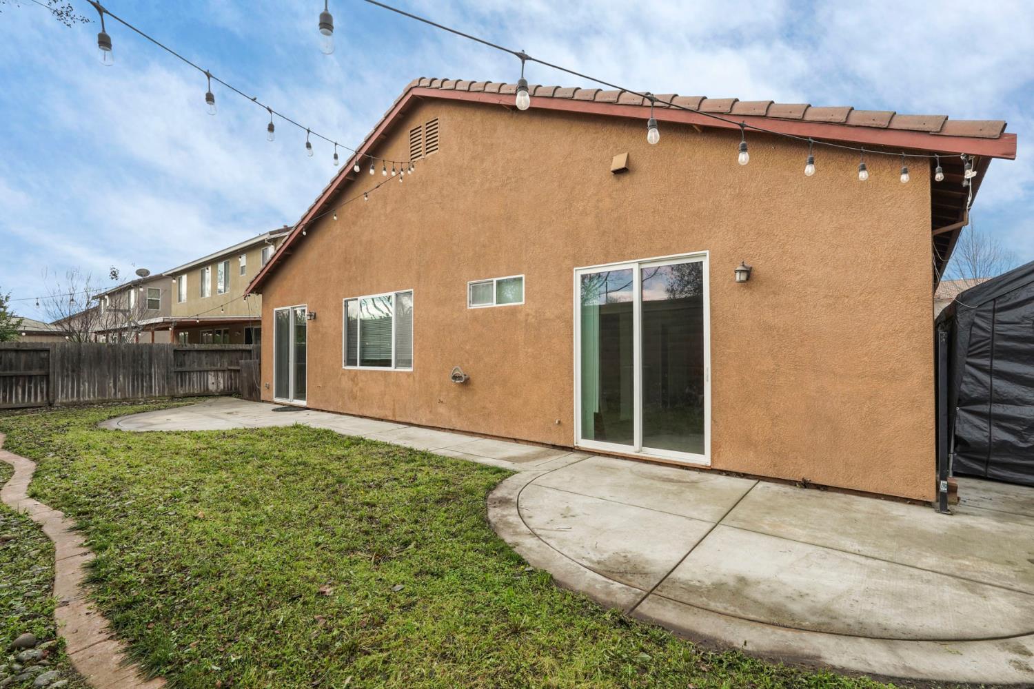 904 Sebastian Lane Manteca, CA 95336 - Photo 21 of 21 a front view of a house with a yard