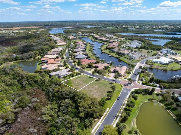 an aerial view of residential building with outdoor space and ocean view