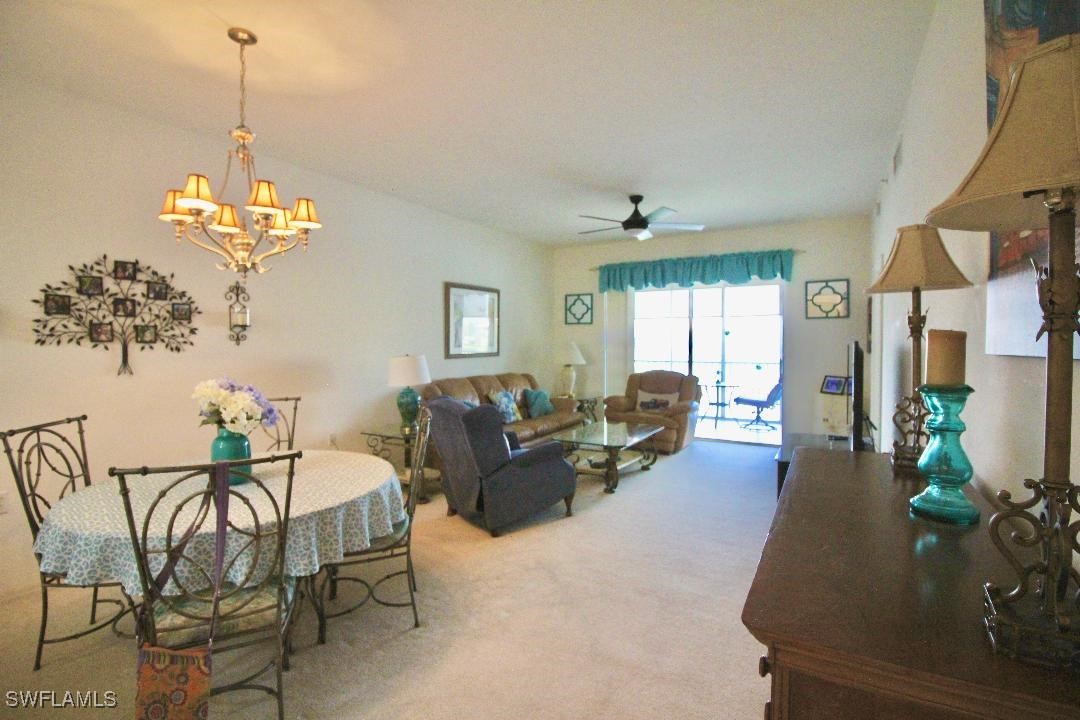 14061 Brant Point Circle, Unit 7304 Fort Myers, FL 33919 - Photo 2 of 49 a living room with furniture chandelier and a chandelier