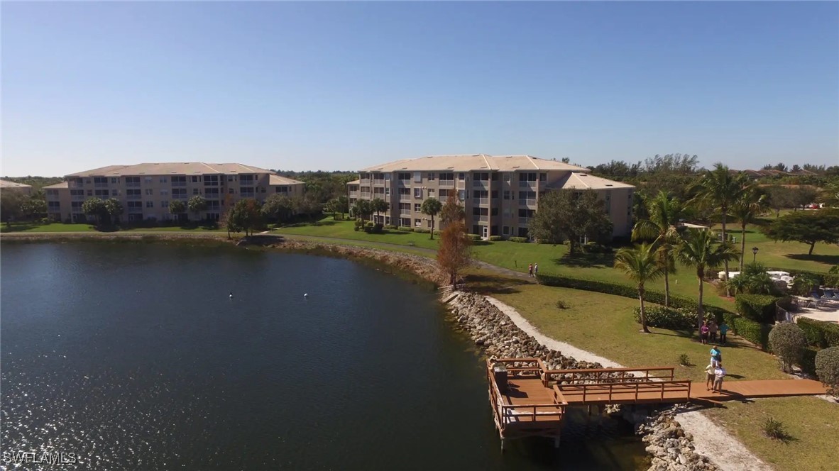 14061 Brant Point Circle, Unit 7304 Fort Myers, FL 33919 - Photo 37 of 49 a view of a swimming pool and lake view