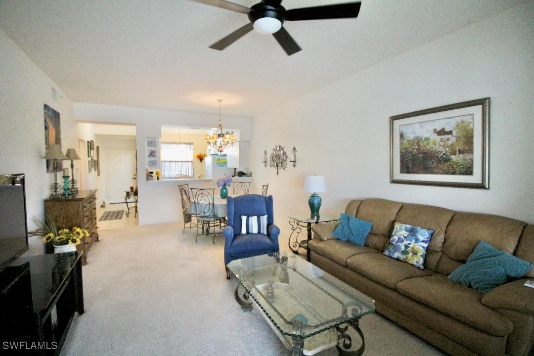 14061 Brant Point Circle, Unit 7304 Fort Myers, FL 33919 - Photo 5 of 49 a living room with furniture and a couch