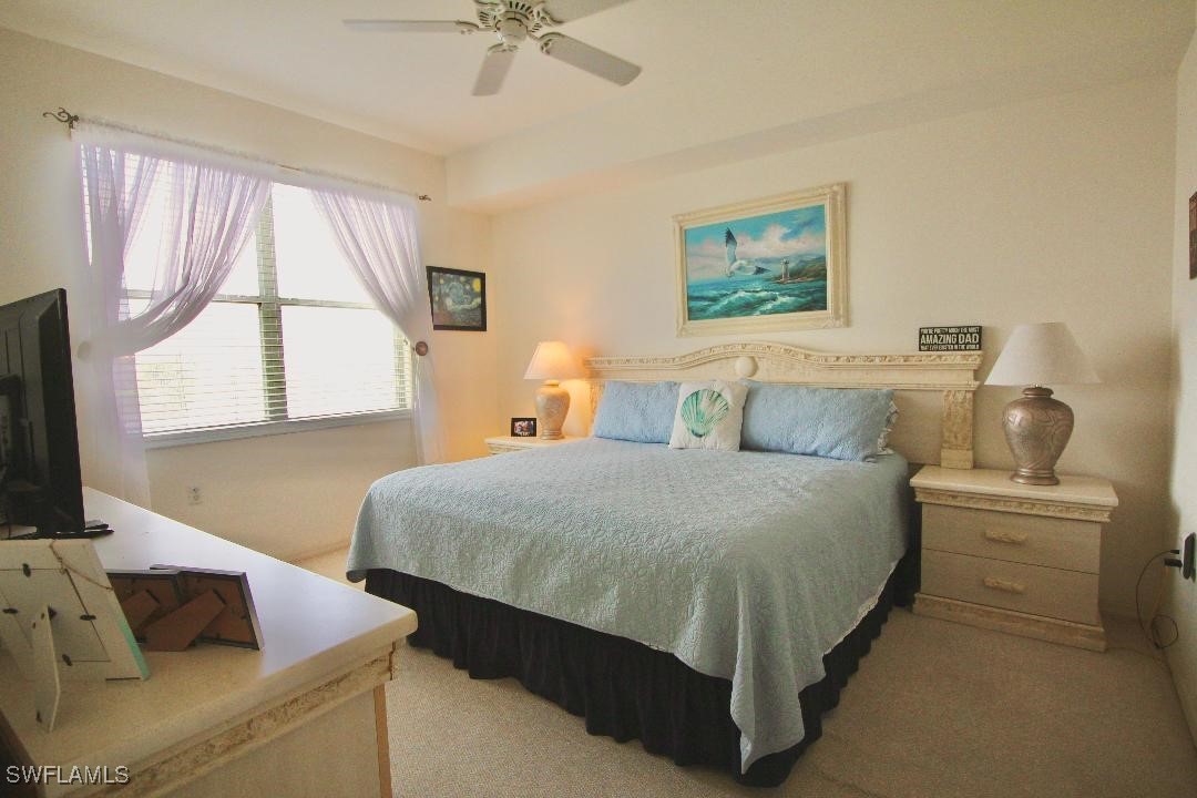 14061 Brant Point Circle, Unit 7304 Fort Myers, FL 33919 - Photo 10 of 49 a bedroom with a bed and window