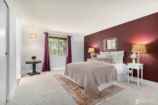 a bedroom with a bed and a sink