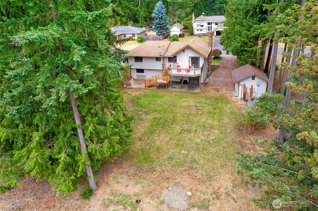 a view of a wooden deck with a yard