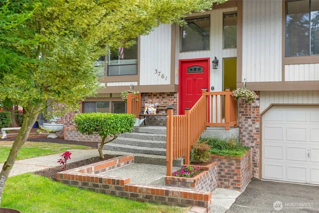 a view of front door of house and car parked