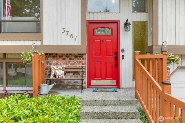 a view of front door of house and car parked
