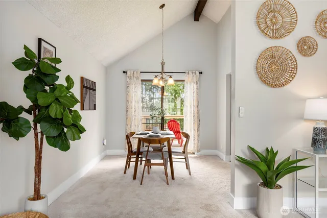 a dining room with furniture potted plants and a potted plant