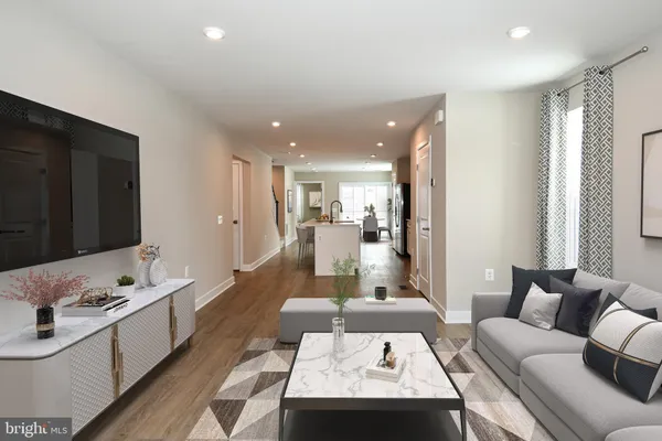 a kitchen with stainless steel appliances a stove microwave and a sink