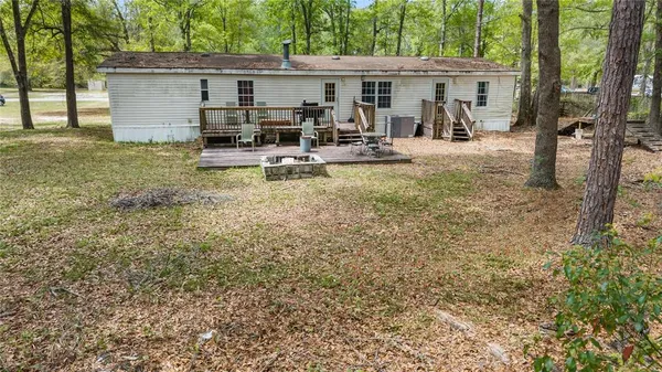a front view of house with yard and seating area