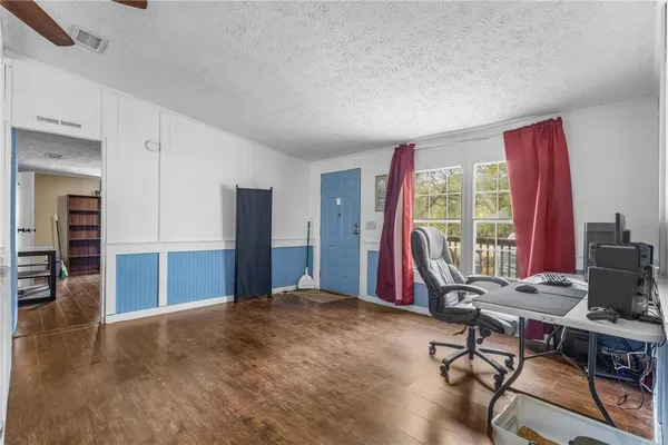 a workspace with furniture and a window