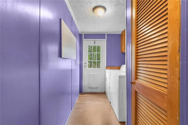 a view of hallway with washer and dryer