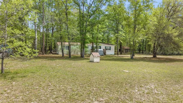 a house with trees in front of it