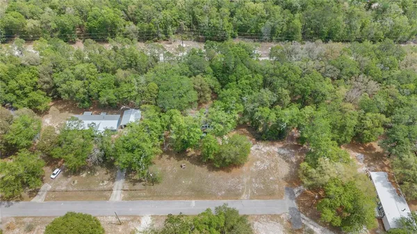 an aerial view of residential house with outdoor space