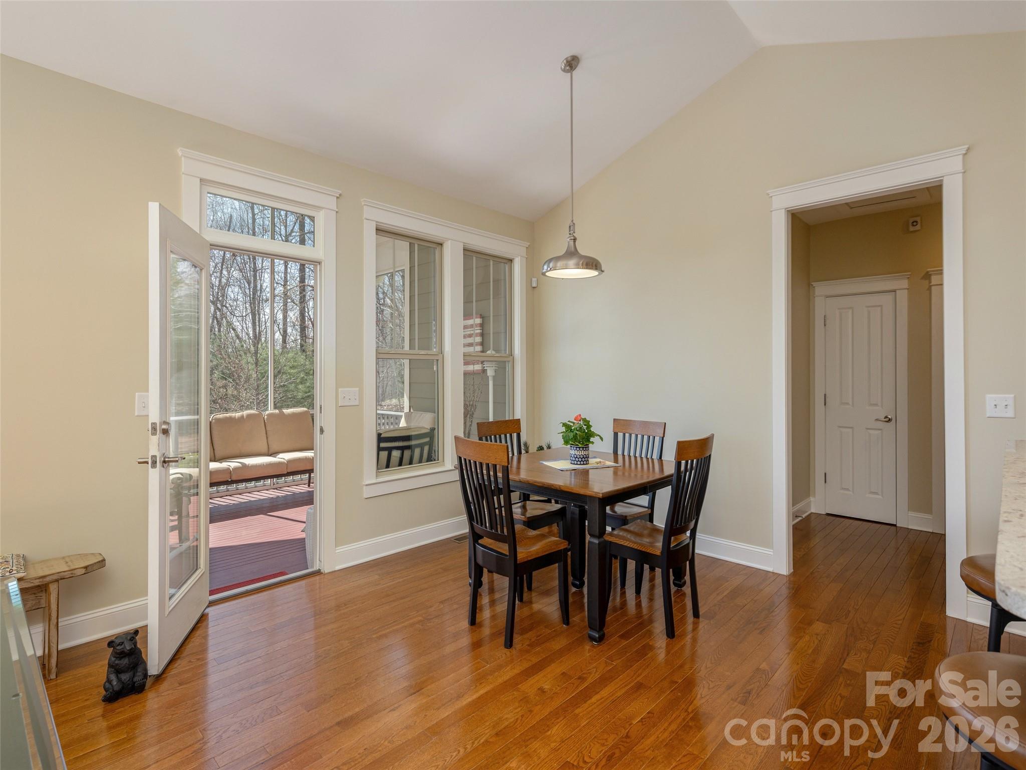 383 Monarch Road Hendersonville, NC 28739 - Photo 11 of 48 a view of a dining room with furniture window and wooden floor