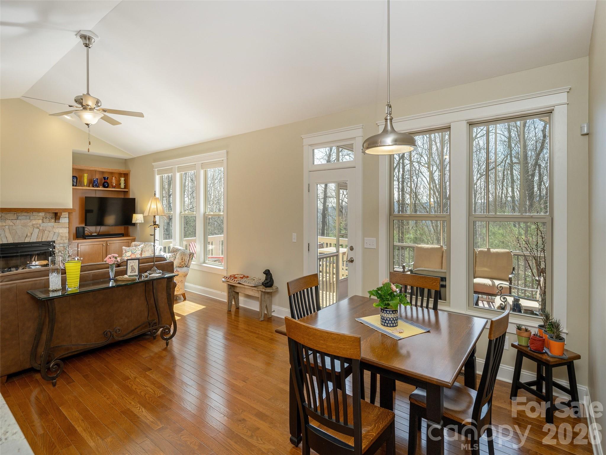 383 Monarch Road Hendersonville, NC 28739 - Photo 16 of 48 a view of a dining room with furniture window and wooden floor