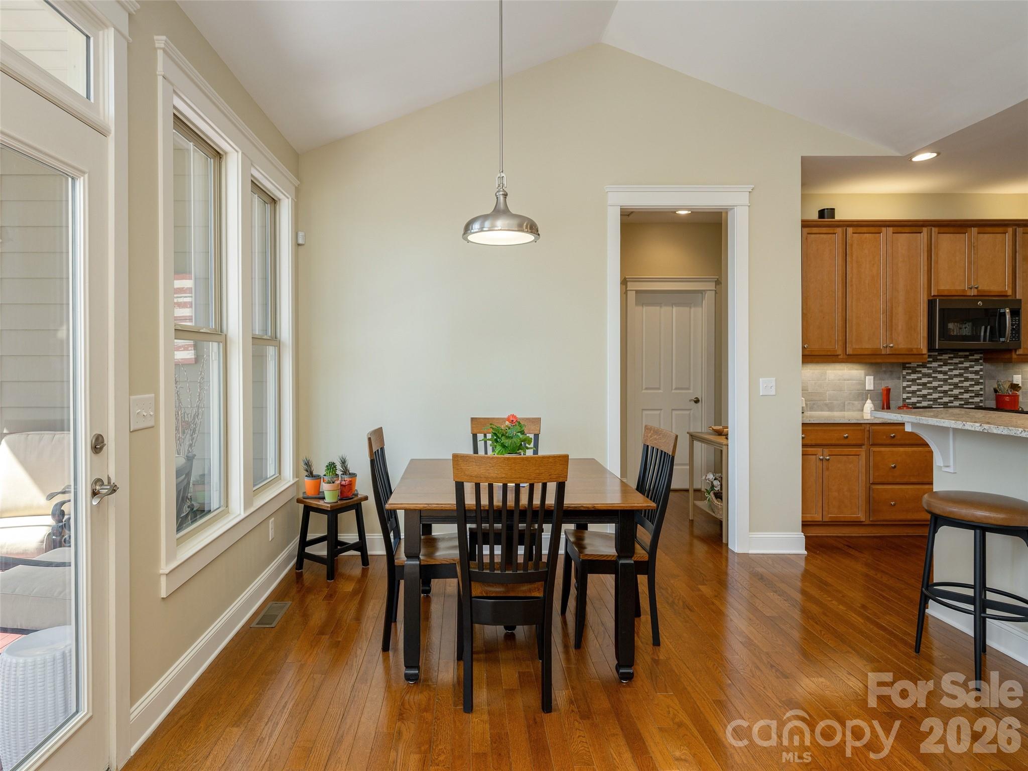 383 Monarch Road Hendersonville, NC 28739 - Photo 17 of 48 a view of a a dining room with furniture window and wooden floor