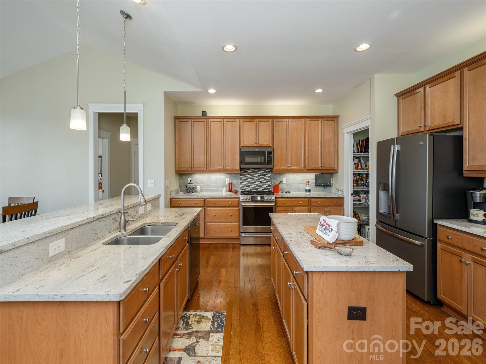 383 Monarch Road Hendersonville, NC 28739 - Photo 20 of 48 a kitchen with kitchen island granite countertop a sink a counter top stainless steel appliances and cabinets