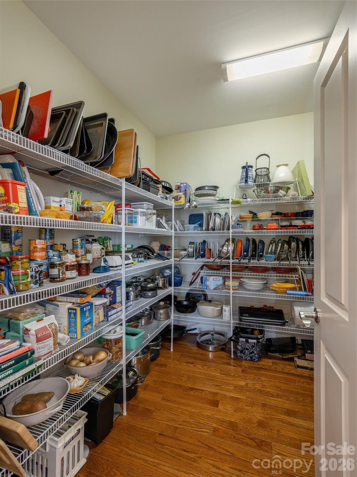 383 Monarch Road Hendersonville, NC 28739 - Photo 22 of 48 a view of walk in closet with clothes and shoes