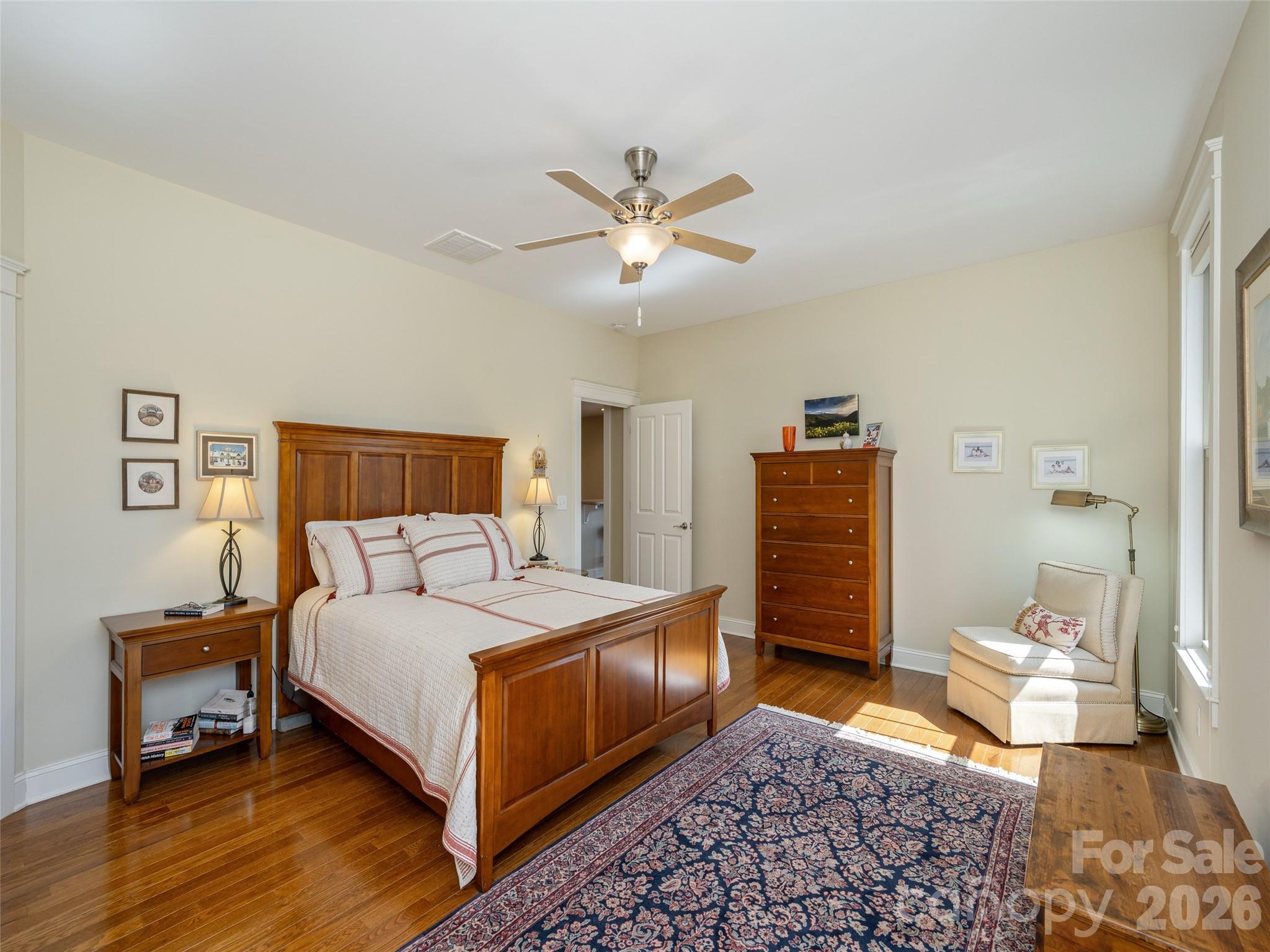 383 Monarch Road Hendersonville, NC 28739 - Photo 24 of 48 a bedroom with a bed and wooden floor