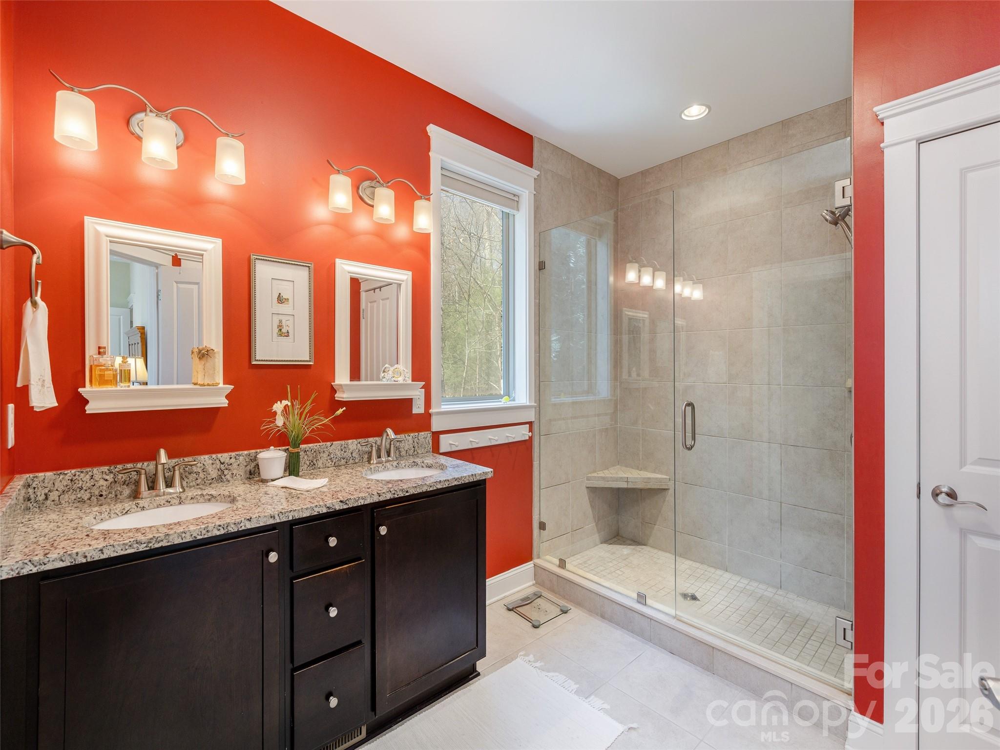 383 Monarch Road Hendersonville, NC 28739 - Photo 26 of 48 a bathroom with a granite countertop sink mirror and shower