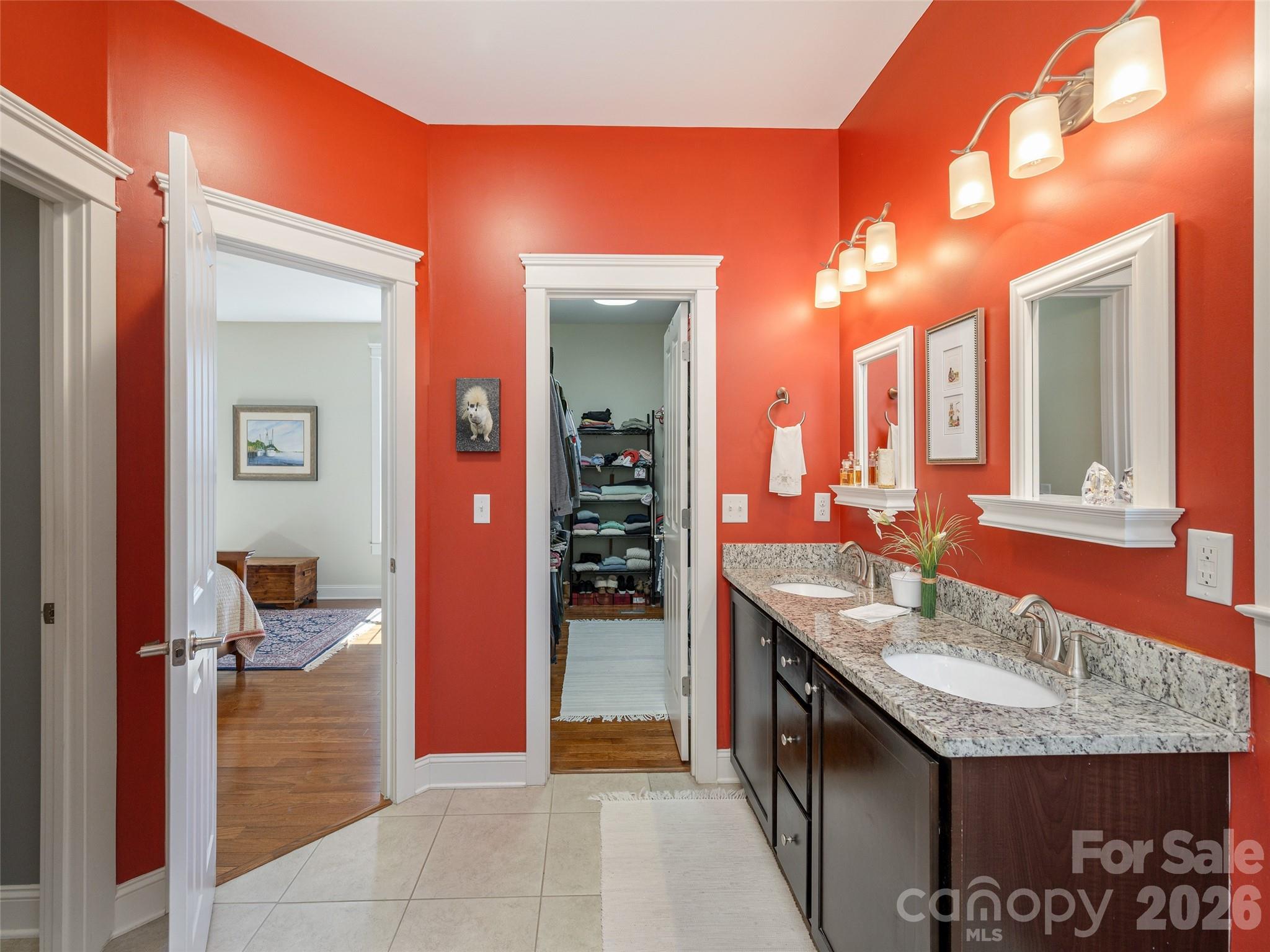 383 Monarch Road Hendersonville, NC 28739 - Photo 28 of 48 a bathroom with a granite countertop sink and a mirror