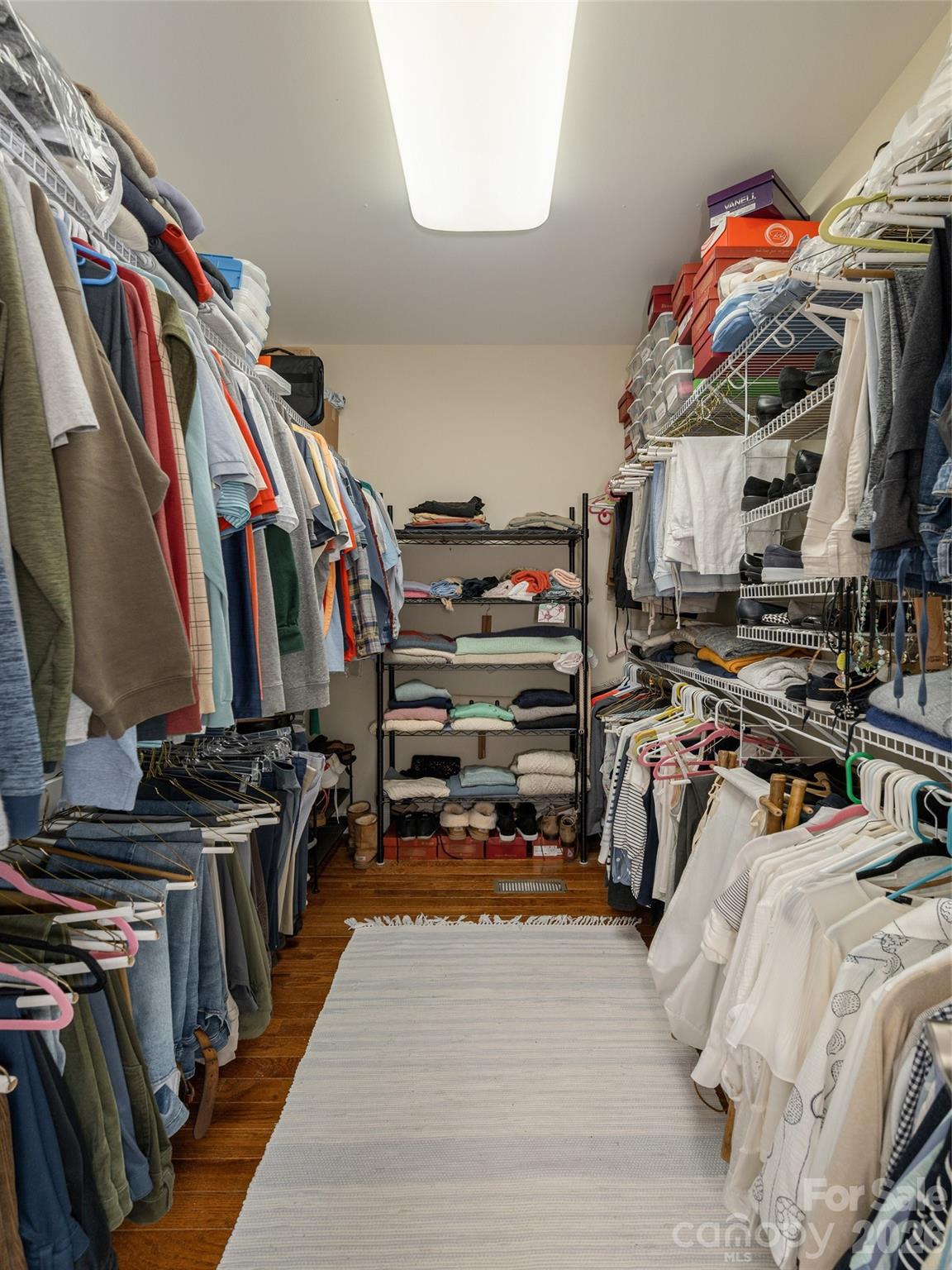 383 Monarch Road Hendersonville, NC 28739 - Photo 29 of 48 a view of walk in closet with clothes and shoes