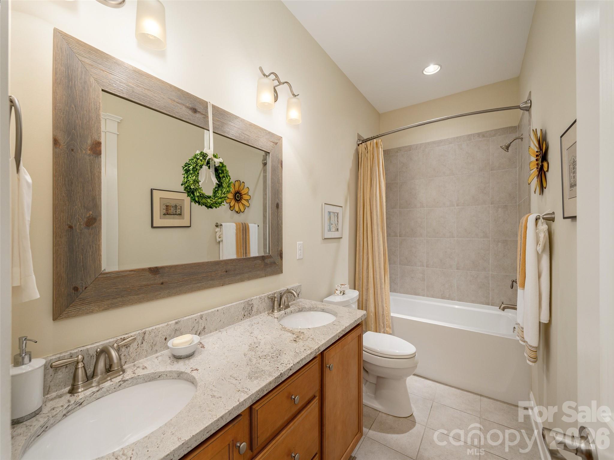 383 Monarch Road Hendersonville, NC 28739 - Photo 31 of 48 a bathroom with a granite countertop sink toilet and shower