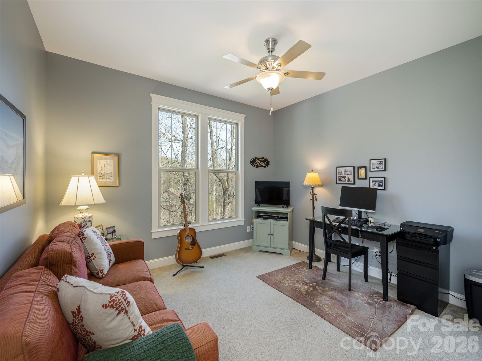383 Monarch Road Hendersonville, NC 28739 - Photo 32 of 48 a living room with furniture a dining table and a piano