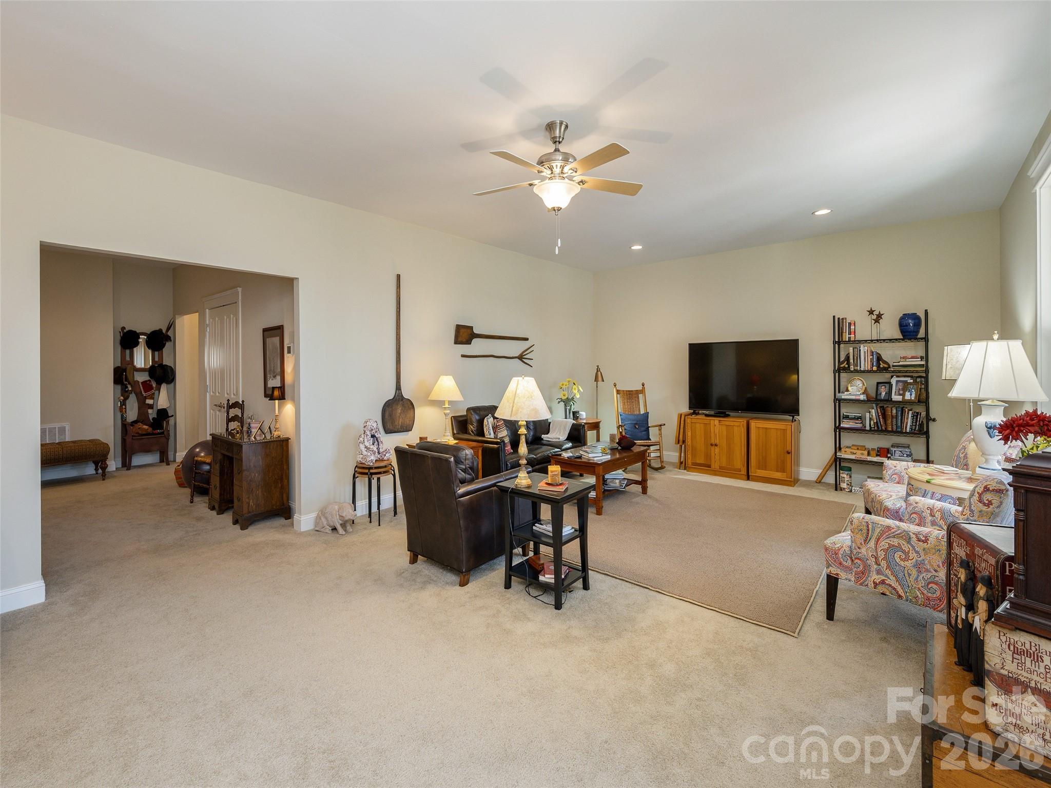 383 Monarch Road Hendersonville, NC 28739 - Photo 36 of 48 a living room with furniture and a flat screen tv