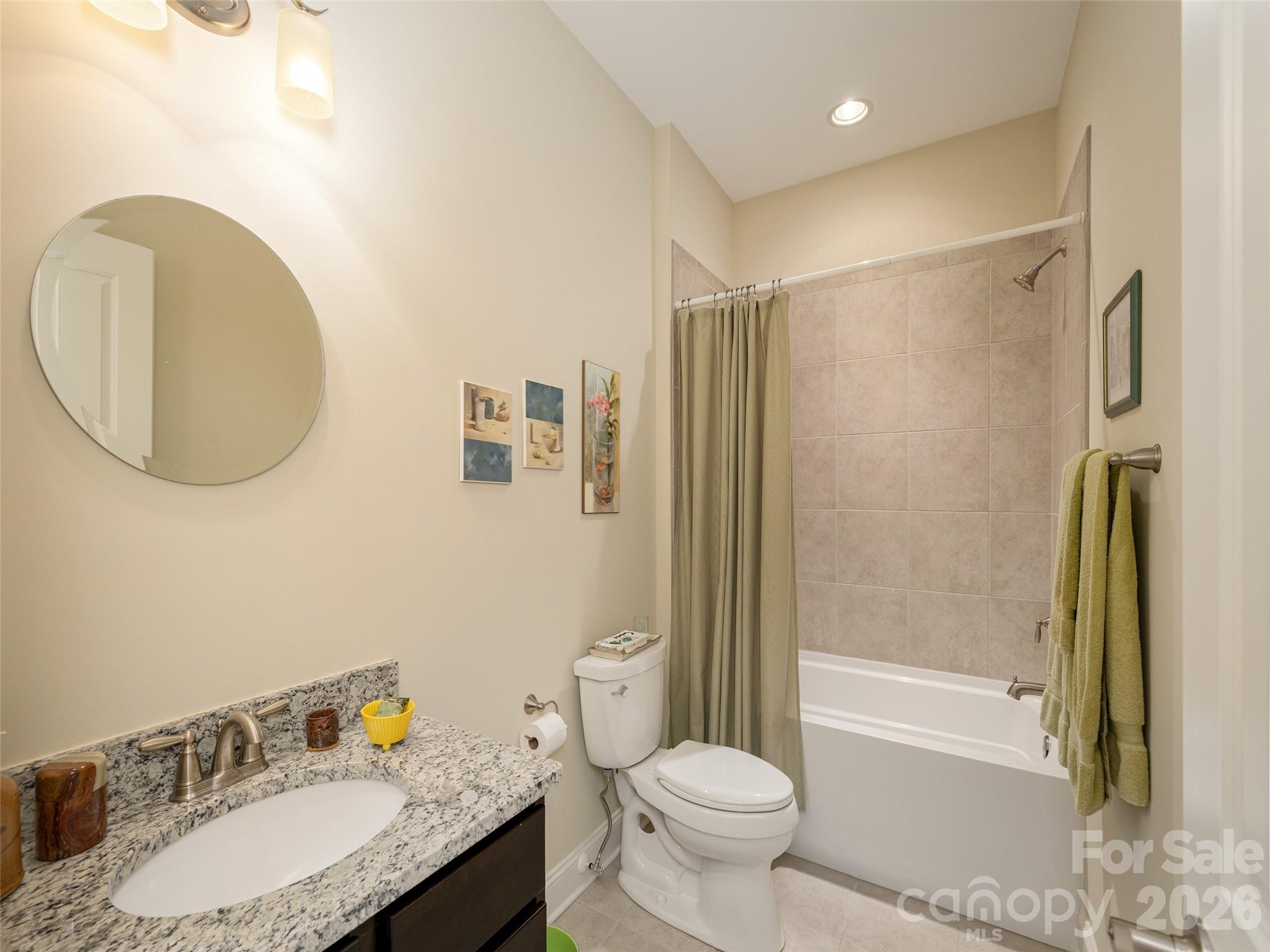 383 Monarch Road Hendersonville, NC 28739 - Photo 40 of 48 a bathroom with a granite countertop sink toilet and shower