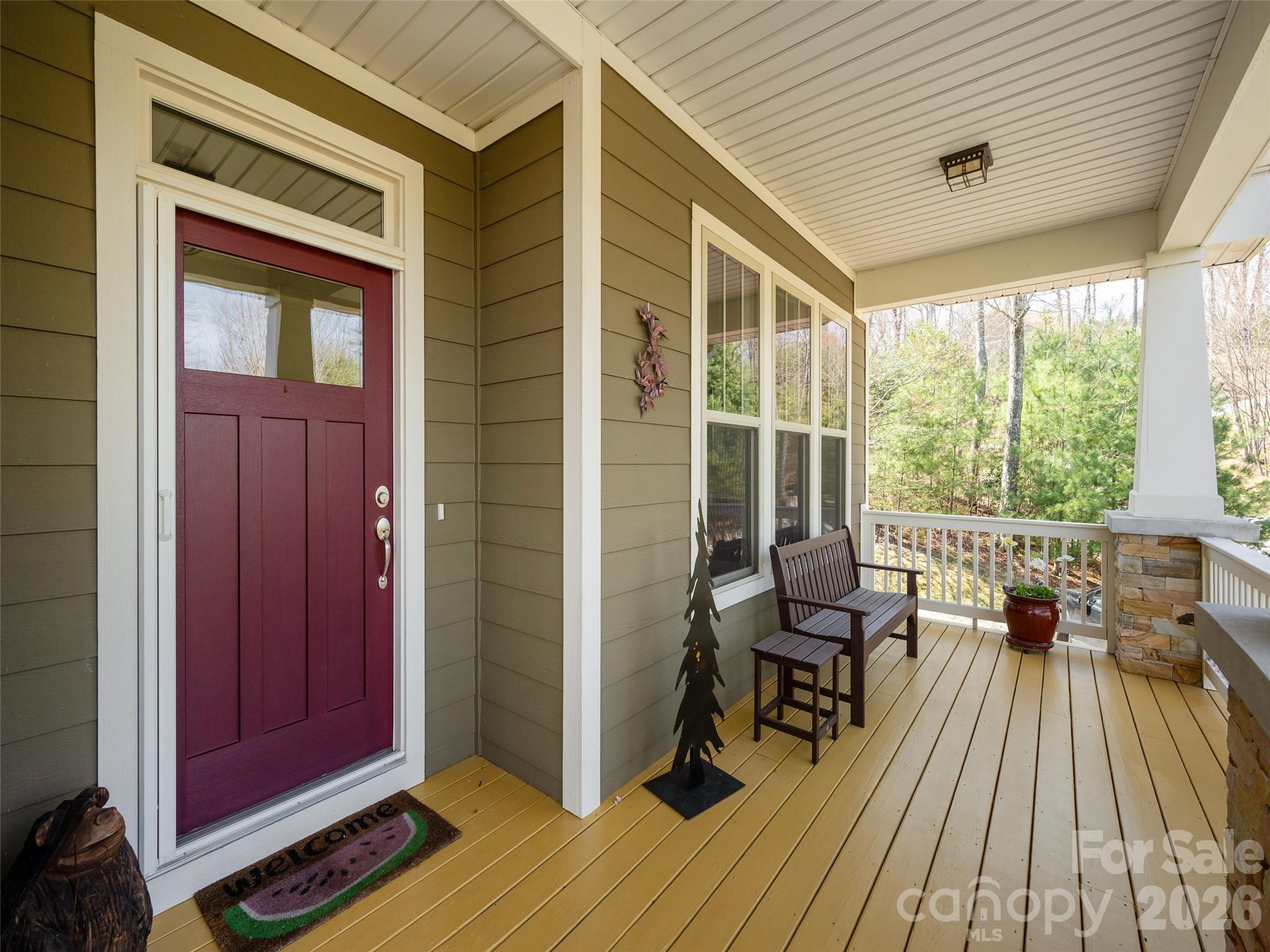 383 Monarch Road Hendersonville, NC 28739 - Photo 4 of 48 a balcony with chairs and wooden floor