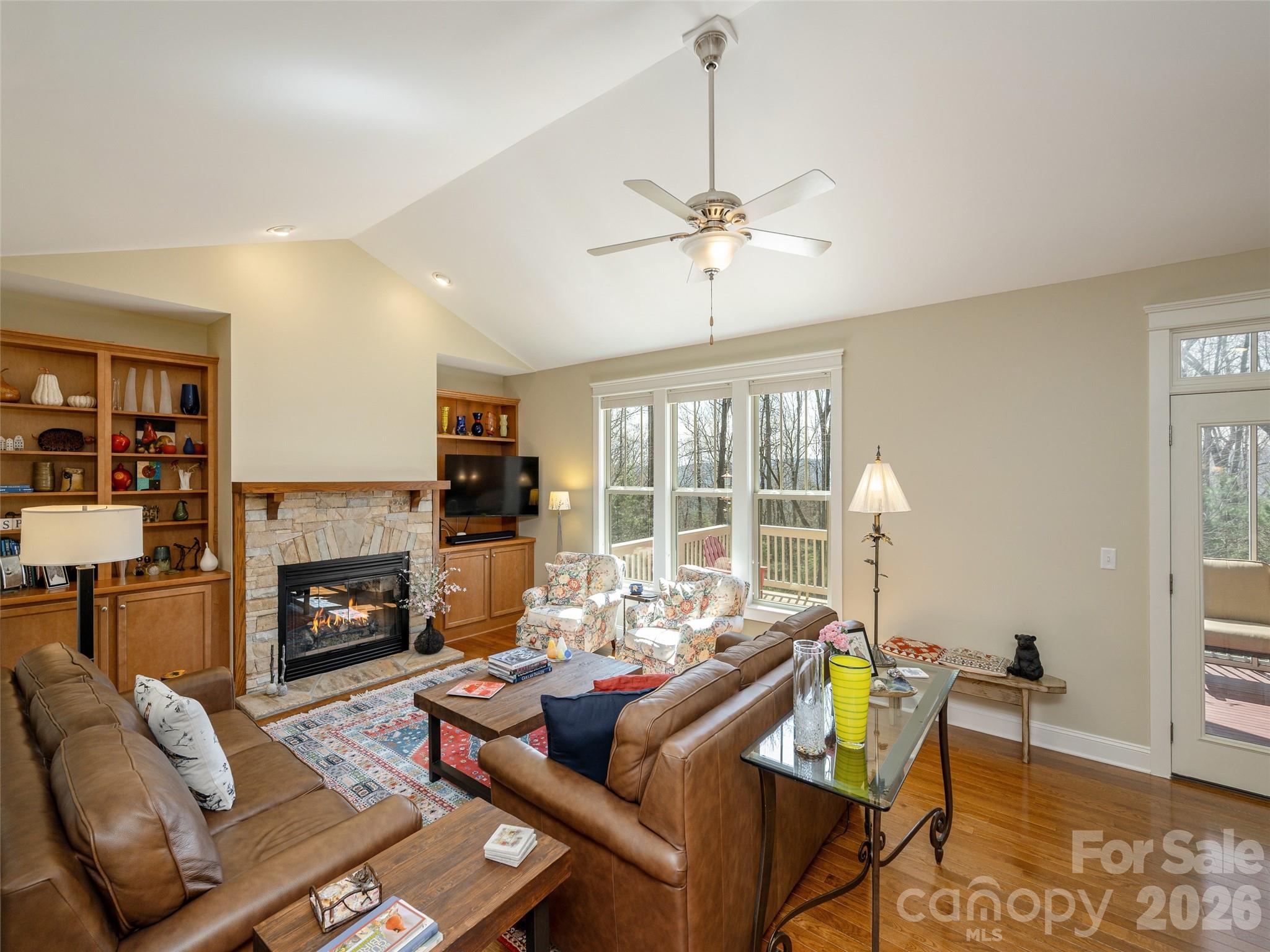 383 Monarch Road Hendersonville, NC 28739 - Photo 7 of 48 a living room with furniture fireplace and a flat screen tv