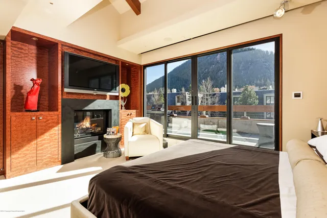 a bathroom with double vanity and a mirror