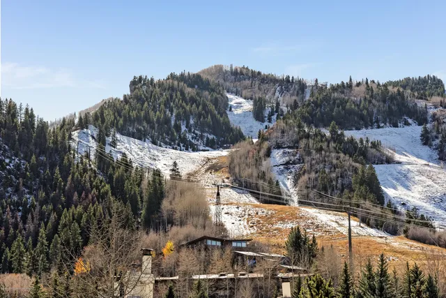 a view of a livingroom with furniture and staircase