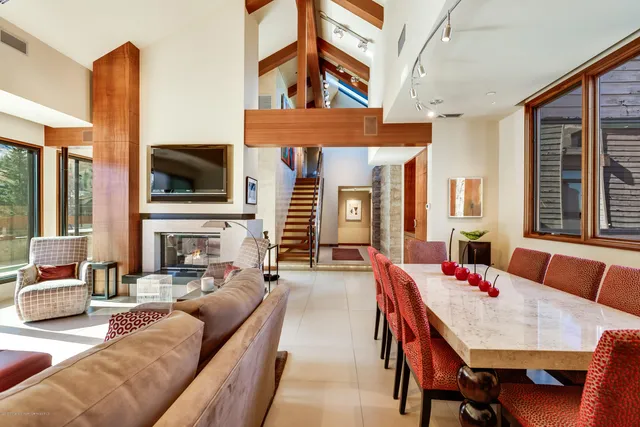 a living room with fireplace furniture and a flat screen tv