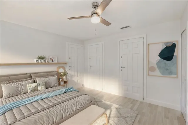 a bedroom with a bed and a shower