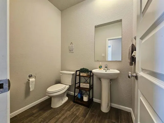 a view of a workspace with furniture and gym equipment